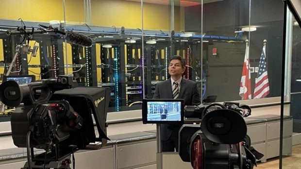 image of students looking at a computer