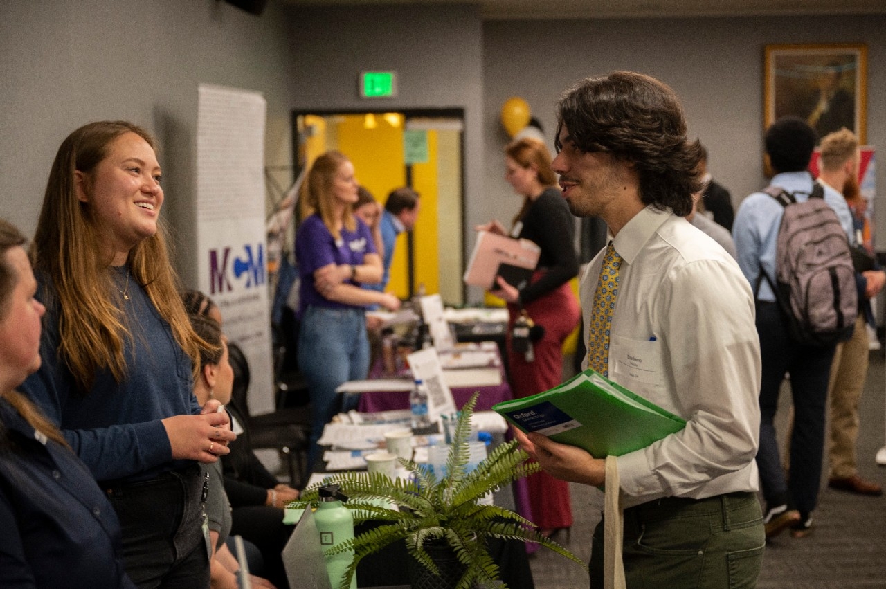 Students speak to employers at on-campus career fair
